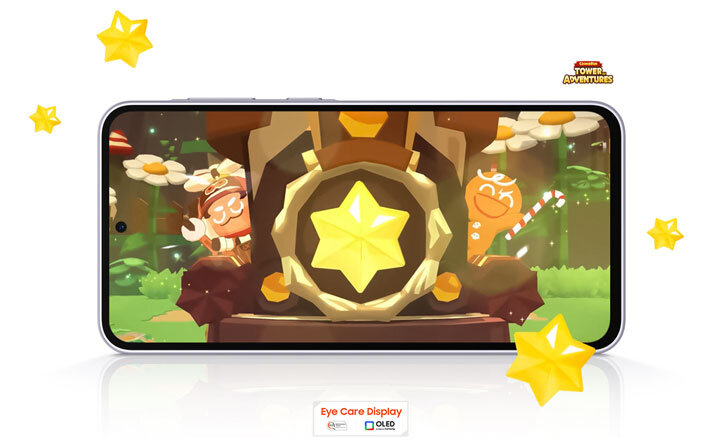 Smartfon wyświetla kolorową grafikę z postaciami i dużą żółtą gwiazdą na ekranie. Pod ekranem widoczny jest tekst: \'Eye Care Display\' oraz logo OLED.