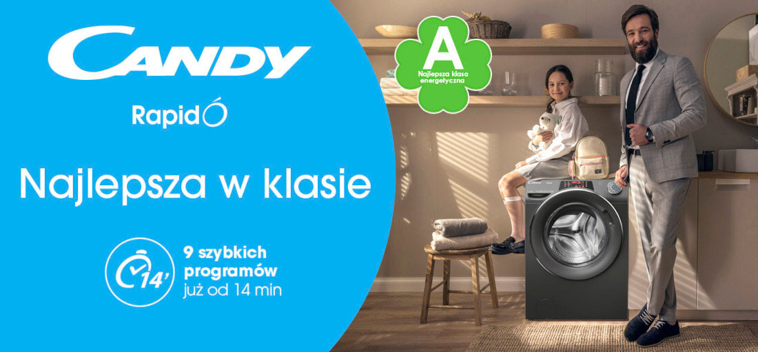 Reklama pralki CANDY z napisem \'Najlepsza w klasie\' oraz informacją o 9 szybkich programach od 14 minut. Obok pralki stoi mężczyzna w garniturze i kobieta siedząca na pralce, a w tle widoczne jest wnętrze kuchni.
