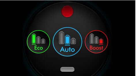 Obraz przedstawia trzy ikony z napisami: \'Eco\' w kolorze zielonym, \'Auto\' w kolorze niebieskim i \'Boost\' w kolorze czerwonym, każda z symbolem baterii. Na górze znajduje się czerwony okrągły przycisk, a poniżej szary prostokątny element.