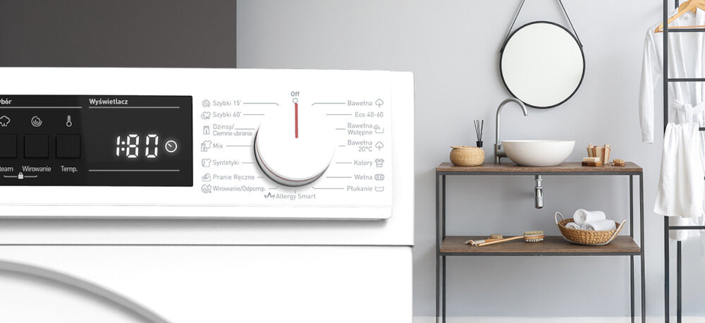PRALKA SHARP ES-NFA612DWB-PL Na zdjęciu widać panel sterowania pralki z różnymi programami prania i elektronicznym wyświetlaczem. Obok znajduje się łazienka z drewnianą umywalką, okrągłym lustrem i półką z ręcznikami oraz akcesoriami. Całość utrzymana jest w jasnej, minimalistycznej stylistyce programy prania różne tkaniny stopień zabrudzenia Cotton Eco 40–60 Wool Colours Mix Jeans Delicate cykle ekspresowe Rapid 15 Fast 60 szybkie pranie odświeżanie ubrań oszczędność energii wody skuteczność wygoda codzienne użytkowanie