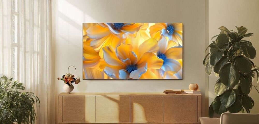 Telewizor TCL 65C6K - Telewizor wiszący na ścianie w pomieszczeniu