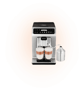 Ekspres do kawy z wyświetlaczem i przyciskami na górze, przygotowujący dwa napoje z mleczną pianką. Obok ekspresu znajduje się metalowy pojemnik połączony rurką.