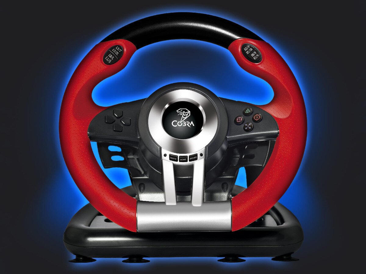 Kierownica do gier z czerwono-czarnym wykończeniem, z widocznym logo \'COBRA\' na środku. Na kierownicy znajdują się przyciski z oznaczeniami, w tym \'L2/L3\' oraz \'R2/R3\'.