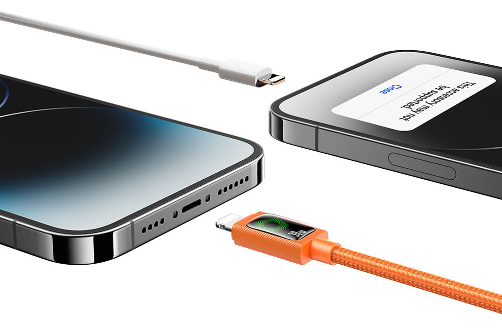 Na obrazie widoczne są dwa smartfony oraz dwa kable USB-C, jeden z pomarańczową końcówką. Na ekranie jednego z telefonów widoczny jest tekst: \'The accessory may not be supported.\'