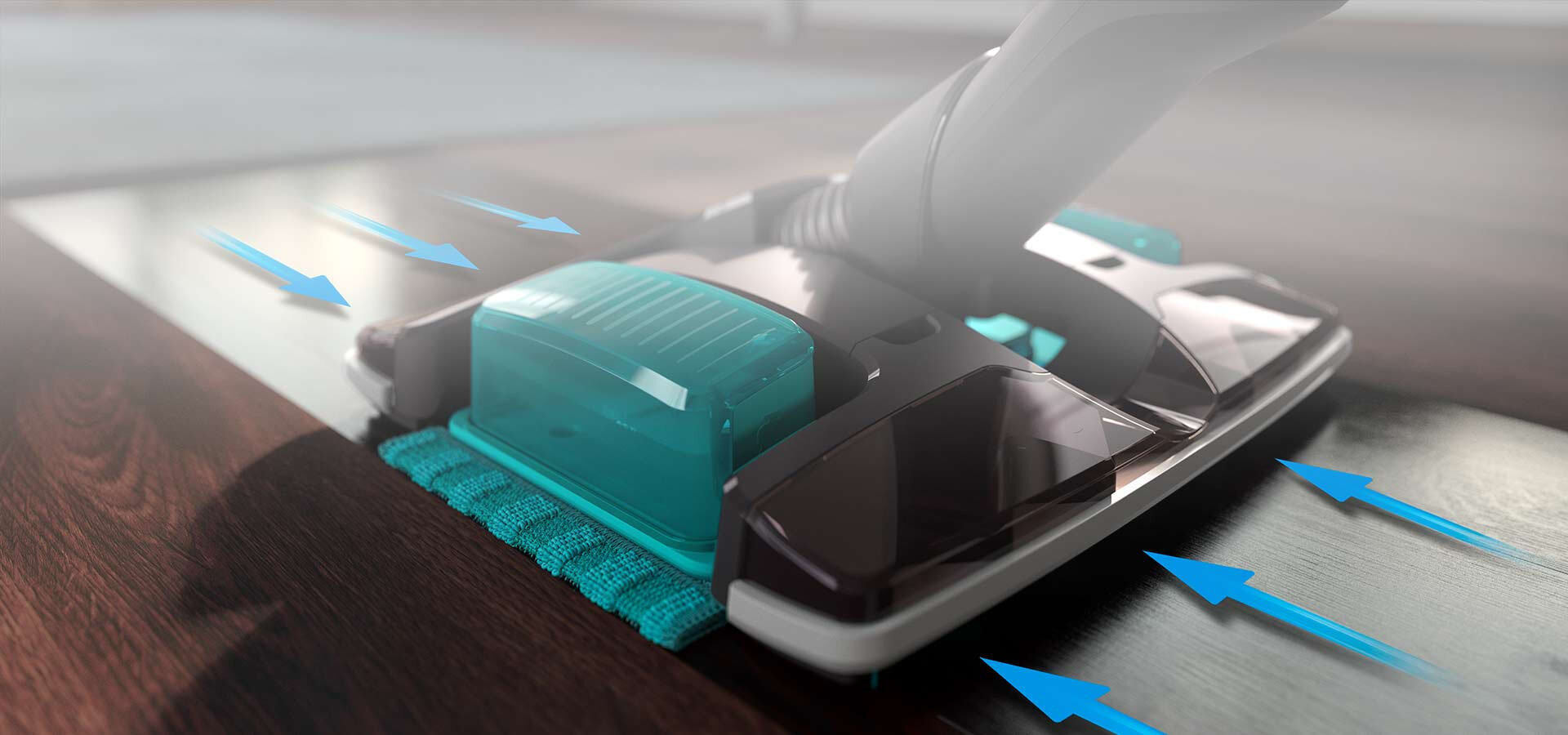 Na obrazie widoczna jest głowica odkurzacza z funkcją mopowania, z przezroczystymi elementami i niebieskimi strzałkami wskazującymi kierunek przepływu powietrza. Podłoga jest ciemna i drewniana.