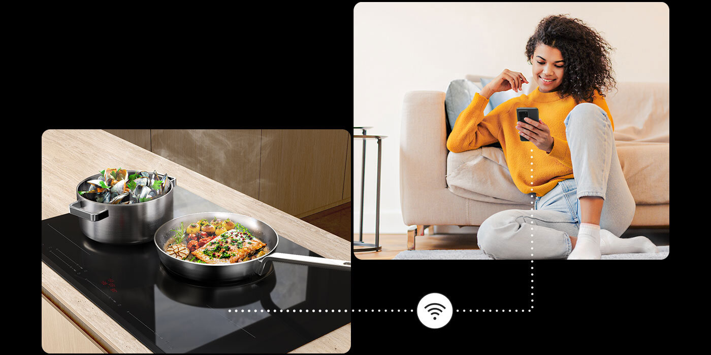 Kobieta kontrolująca gotujące się potrawy na płycie indukcyjnej przez telefon