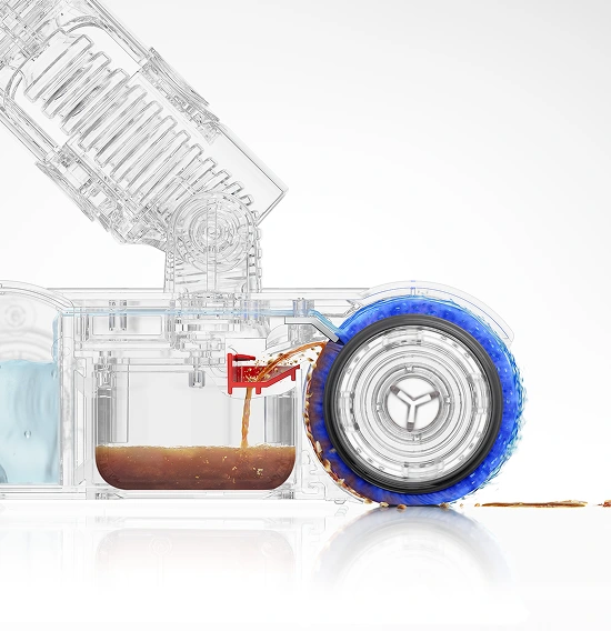 Obraz przedstawia przezroczysty mechanizm urządzenia z widocznym kołem pokrytym niebieską substancją. Widać również pojemnik z brązową cieczą oraz rurkę odprowadzającą płyn.