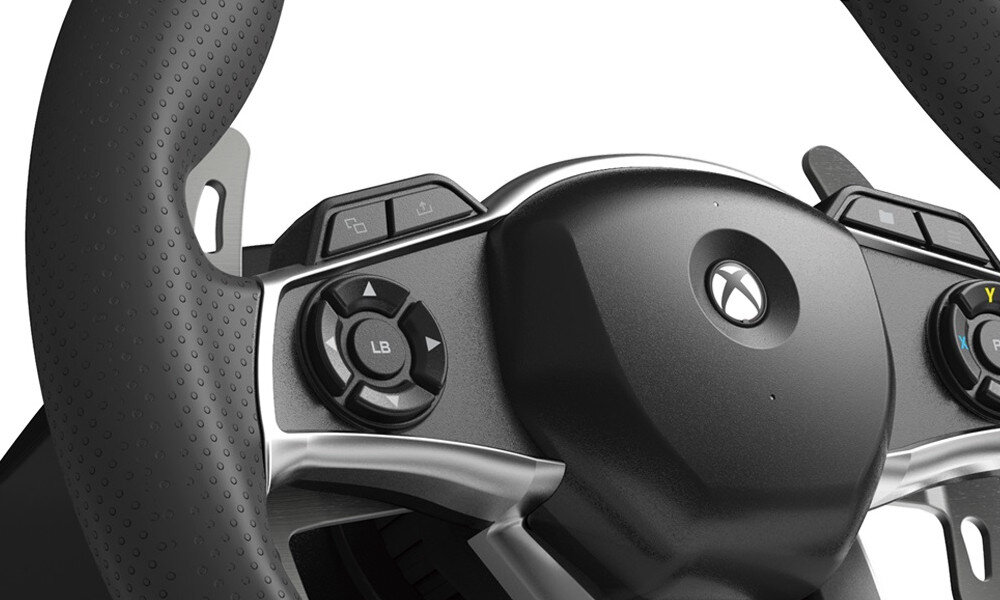 Fragment kierownicy do gier z widocznymi przyciskami, w tym logo przypominające literę X oraz przycisk oznaczony jako \'LB\'.