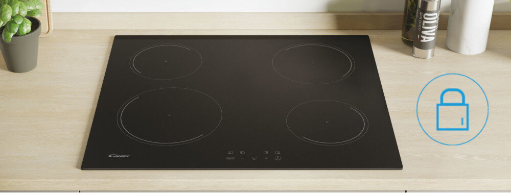 Czarna płyta indukcyjna z czterema okrągłymi polami grzewczymi i panelem dotykowym. Obok płyty znajduje się niebieska ikona kłódki.