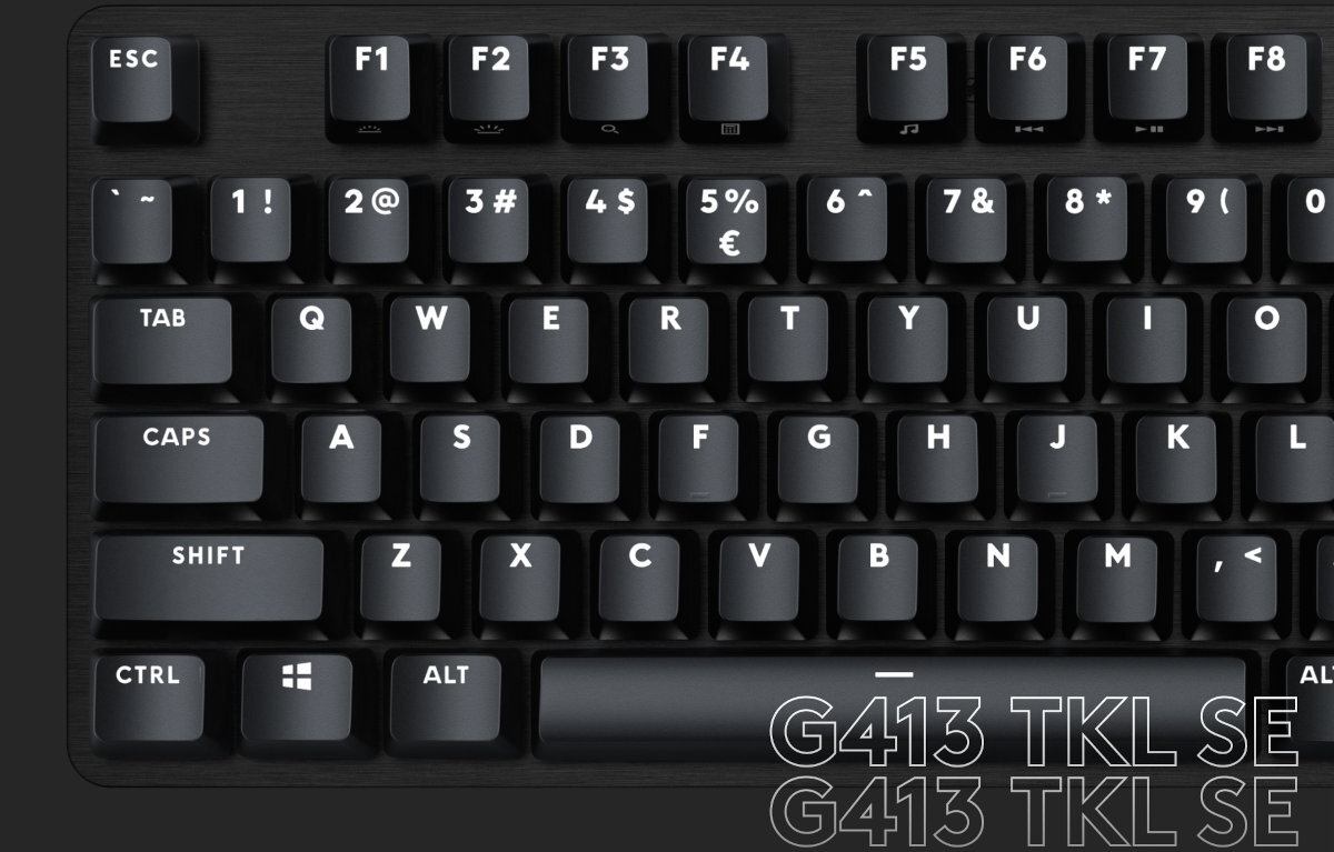 Obraz przedstawia klawiaturę z widocznymi klawiszami funkcyjnymi i literowymi, w tym ESC, F1-F8, TAB, CAPS, SHIFT, CTRL, ALT. Na dole widoczny jest tekst: \'G413 TKL SE G413 TKL SE\'.