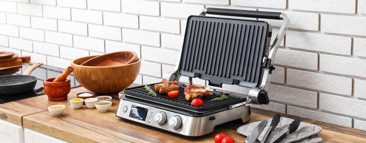 grill elektryczny z wymiennymi płytkami